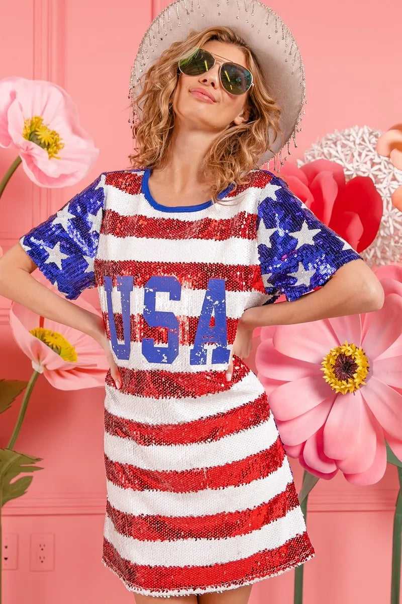 Woman celebrating outdoors in shimmering USA flag sequin dress at sunset


