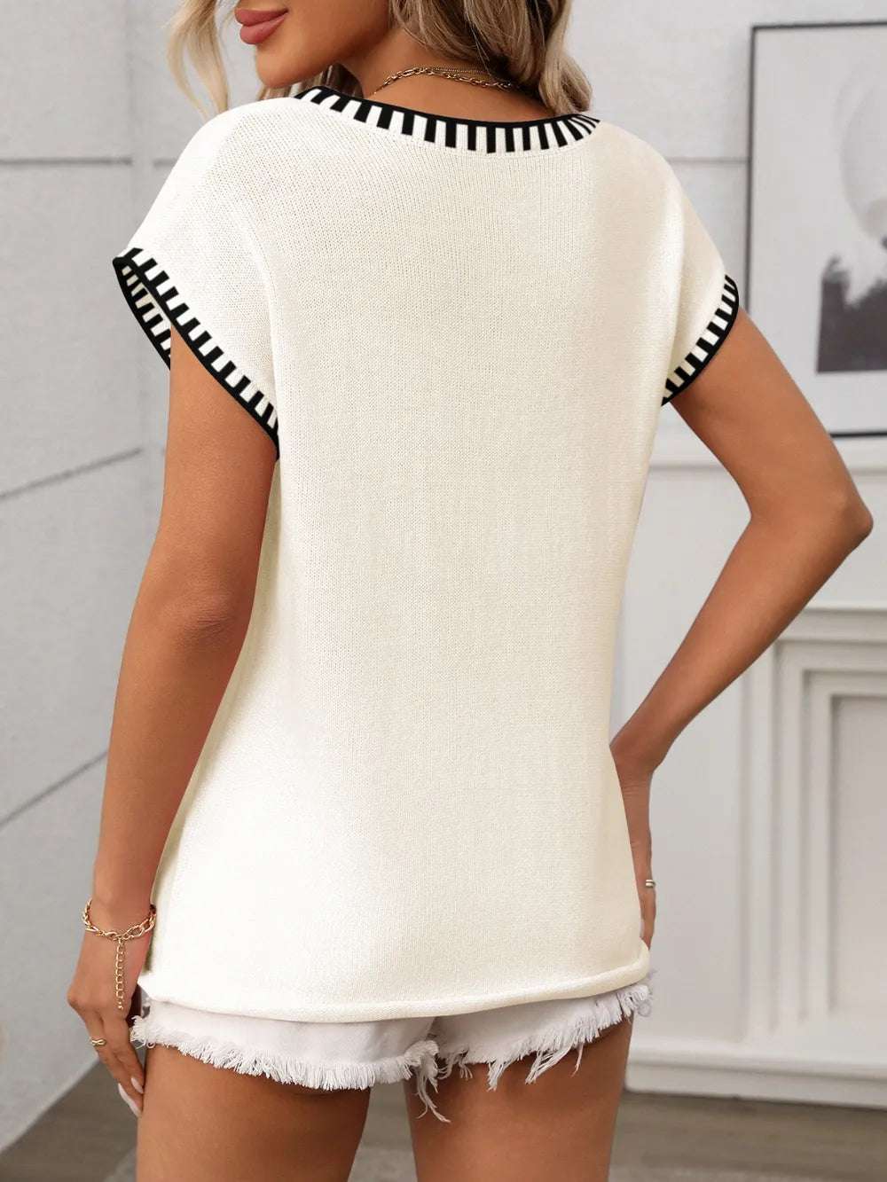 Close-up of fabric blend on V-neck knit top, polyester-viscose

