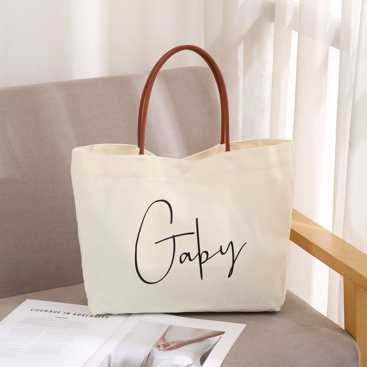 Women’s fashion tote bag – flat lay featuring notebook, wallet, phone