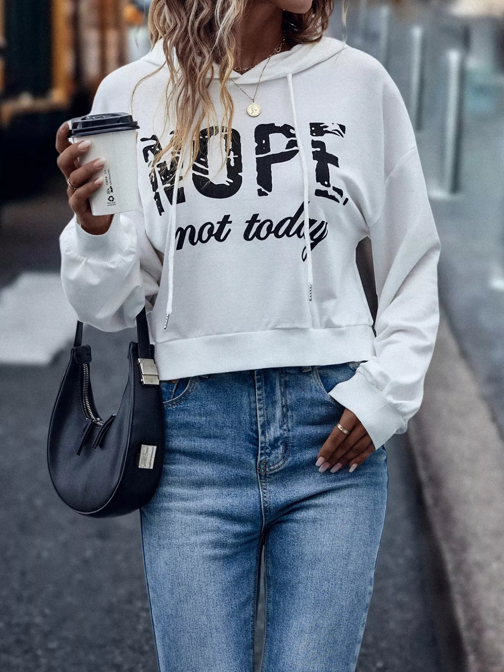 Women’s letter graphic hoodie back view – clean seams and relaxed long sleeves