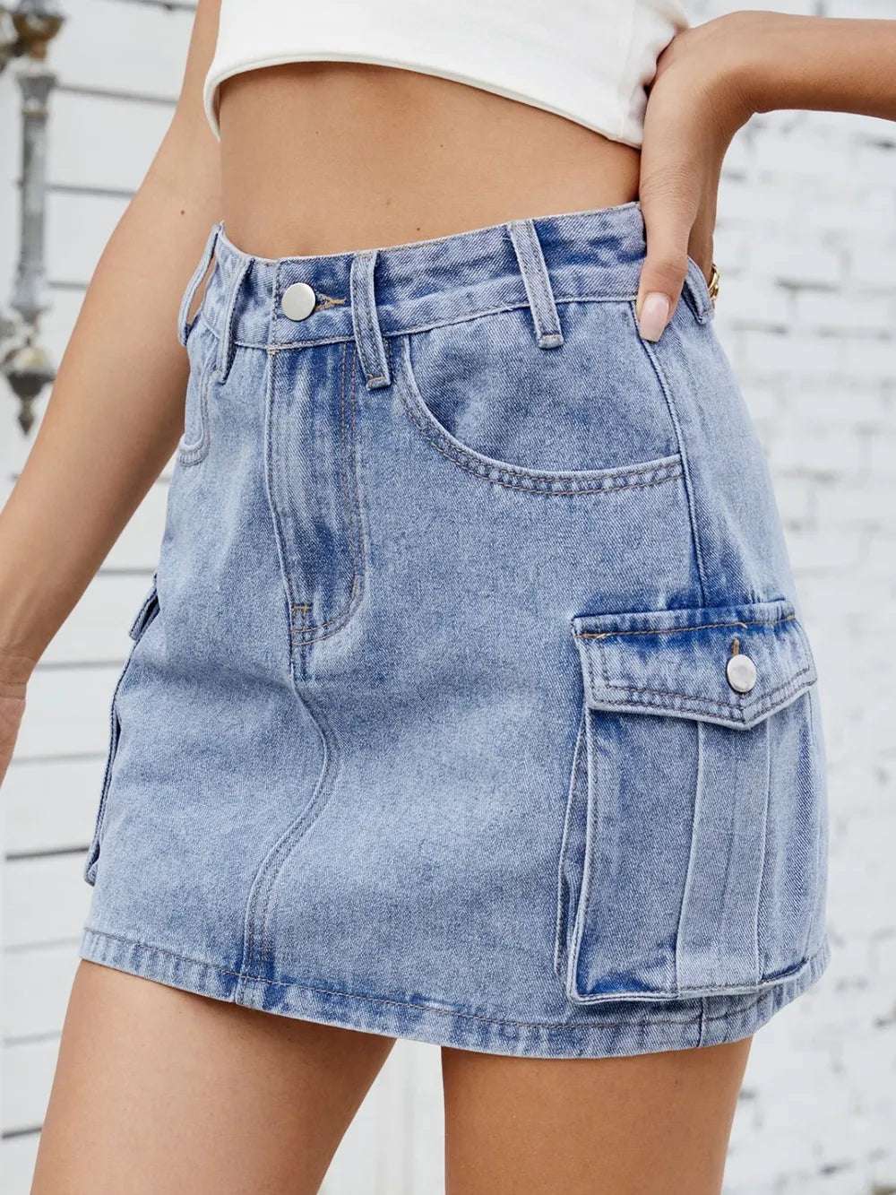 Waistband and hem details of non-stretch denim skirt


