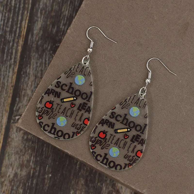 One-pair acrylic earrings shown in minimalist style flat lay

