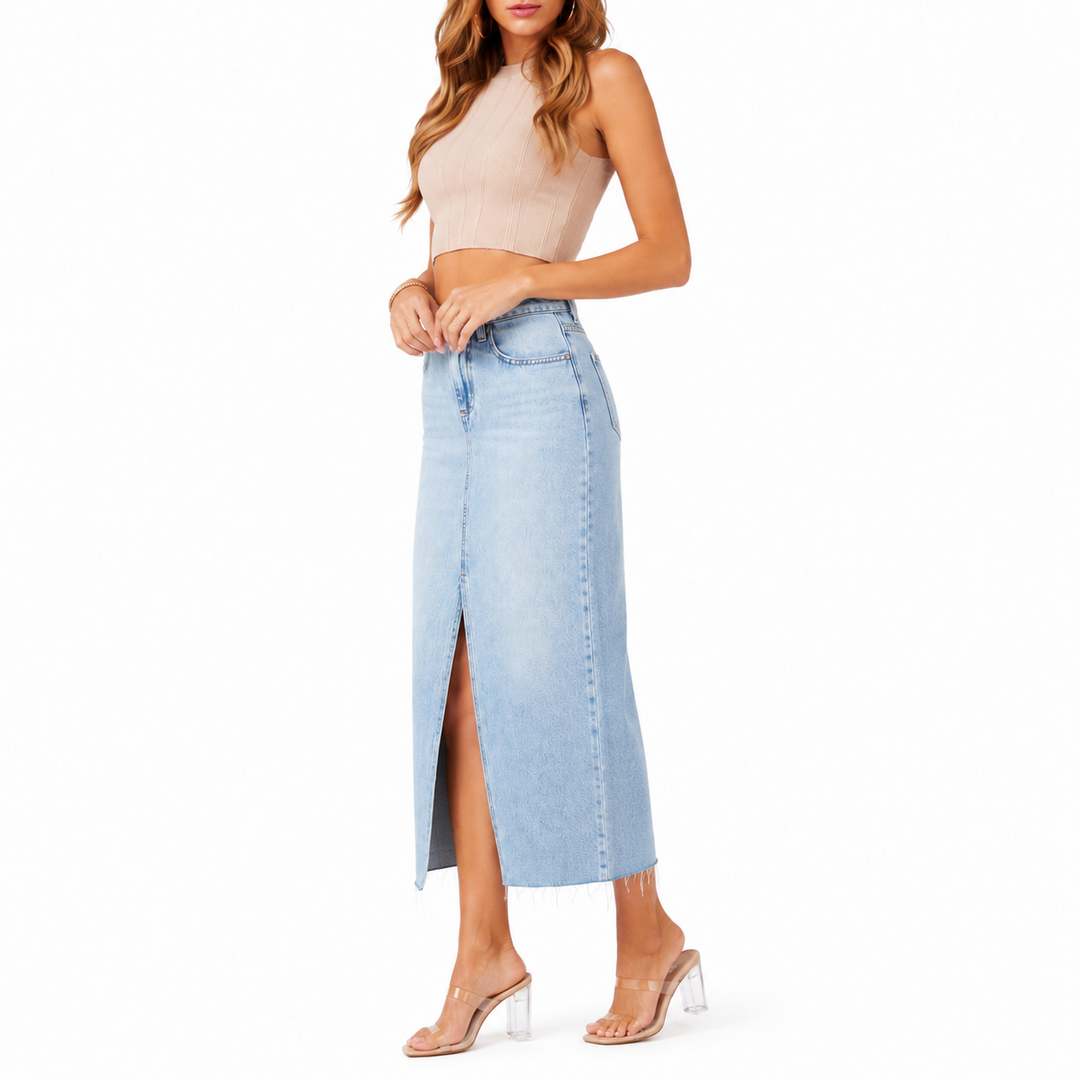 Light wash blue denim midi skirt side fit view showing silhouette and front slit