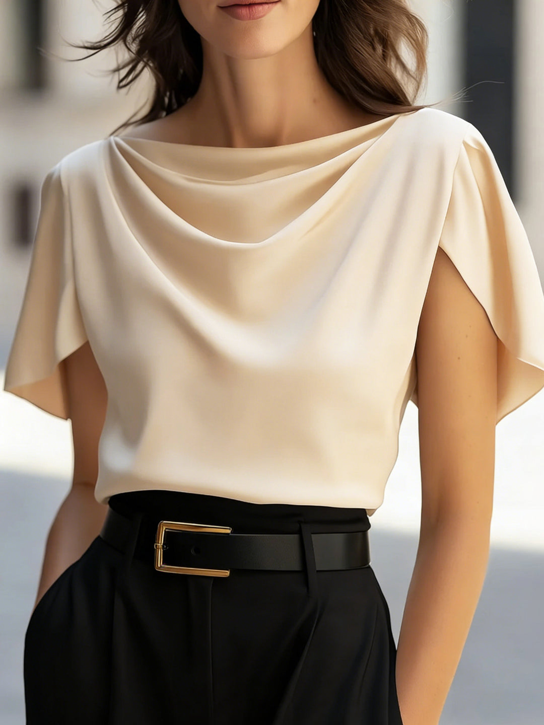 Full-length shot of model in apricot scoop neck top and midi skirt, brunch-ready elegant style
