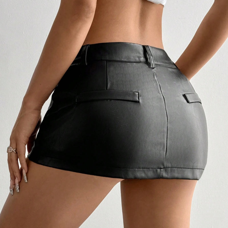 Close-up of zipper detail on black PU leather bodycon skirt, punk style accent
