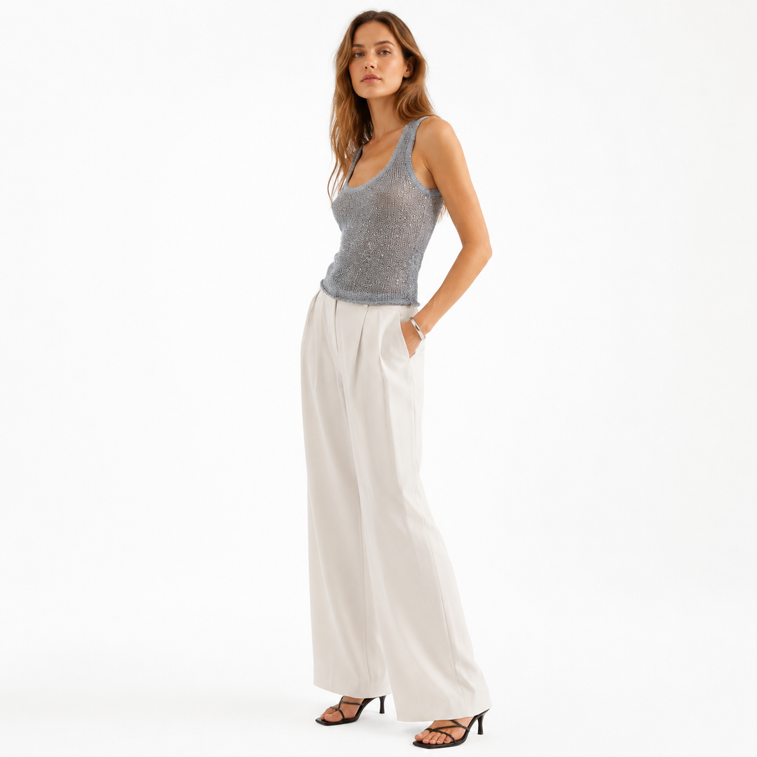 Women’s sleeveless party top with shimmer finish, slim fit, and easy summer outfit styling