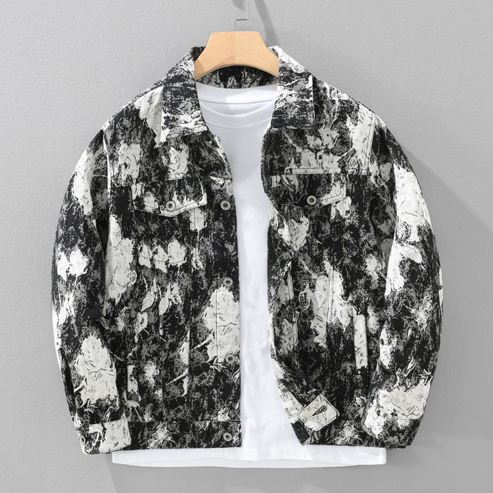 Black and white floral patterned jacket on a mannequin against a gray background