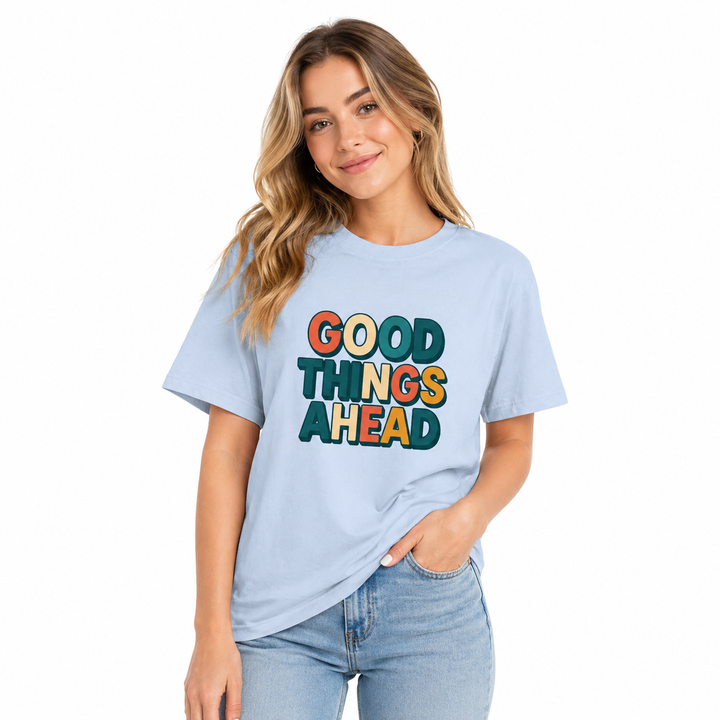 Woman wearing a light blue t-shirt with &