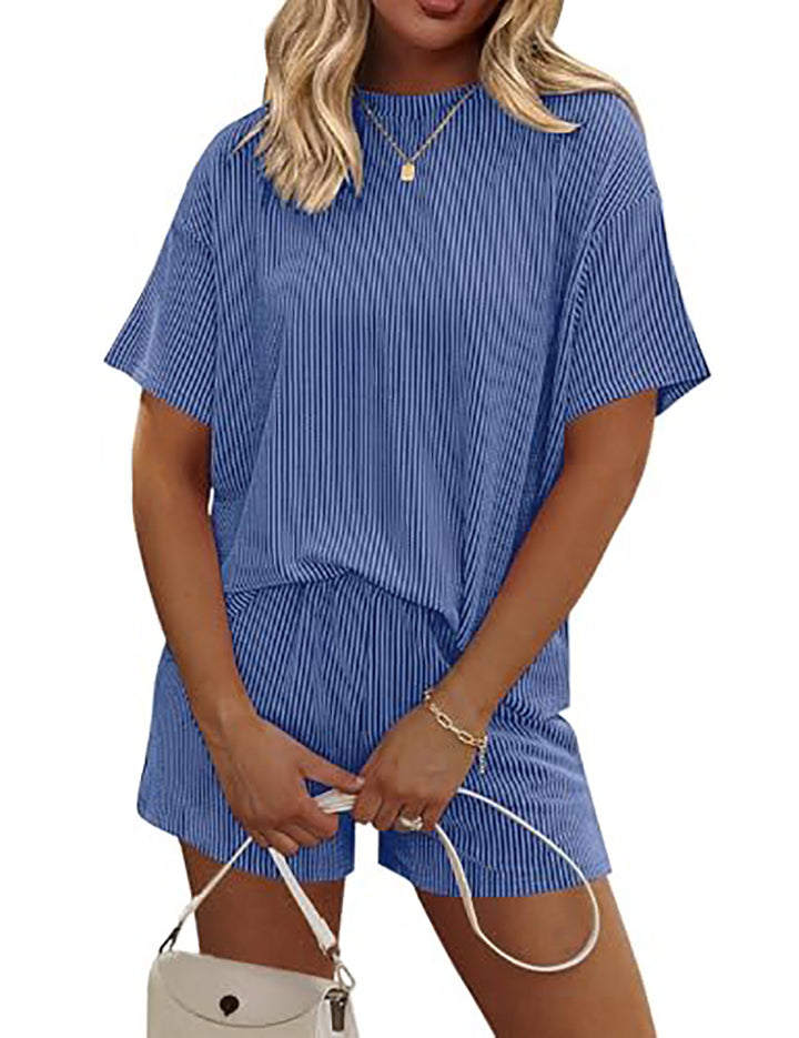 Flat-lay of orange red striped co-ord set for women, top and pants laid neatly side by side
