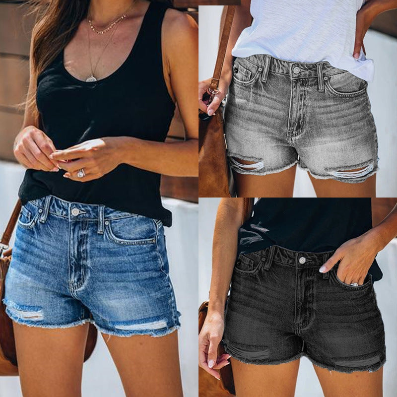 "fringe denim shorts side view showing clean waistband and distressed holes in blue, easy streetwear styling for summer"
