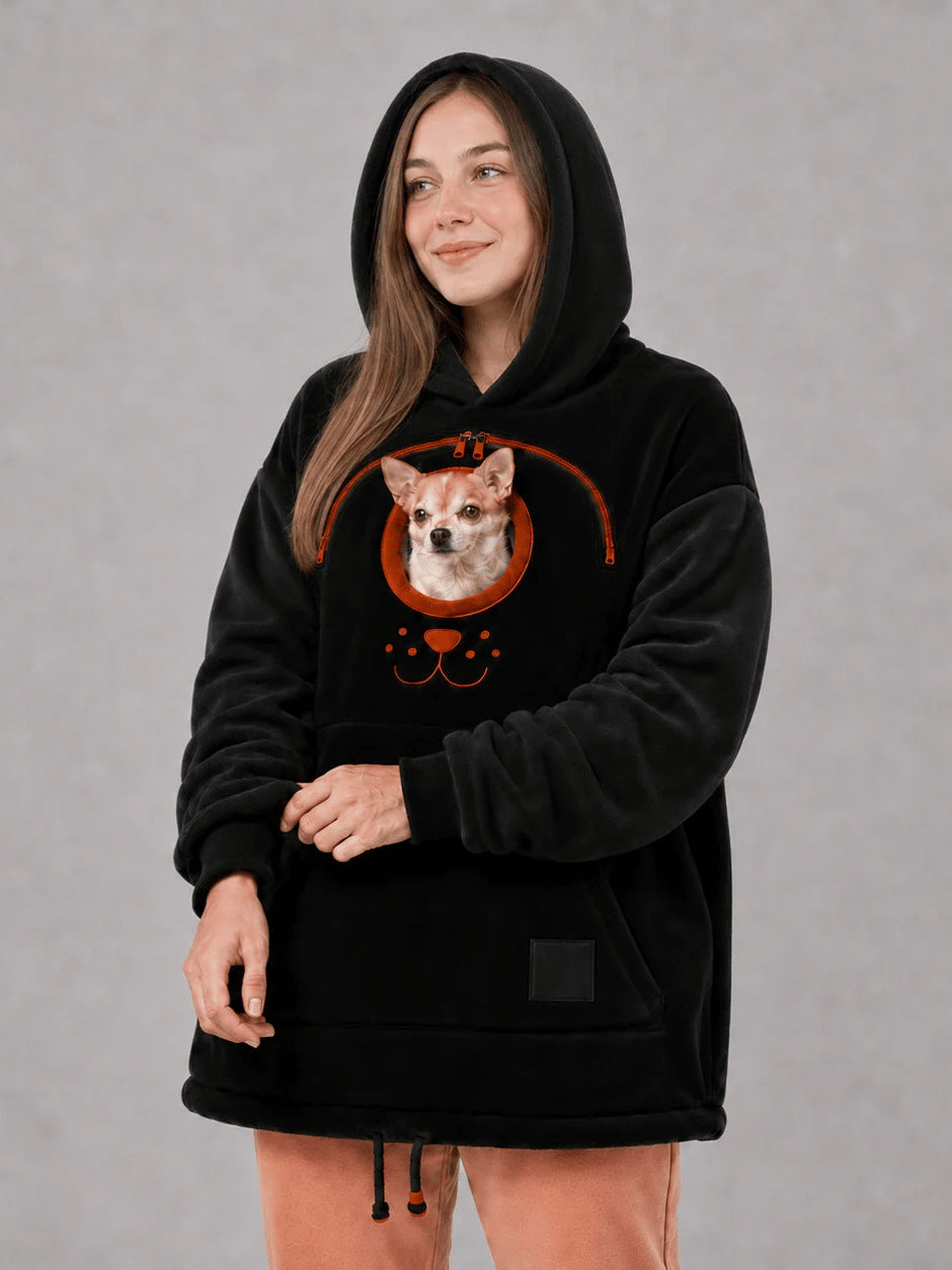 Original image: Woman in a black hoodie with an orange zipper and a small dog photographed with the footwear details visible.
