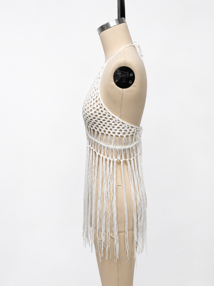 Hand crochet beach cover up with halter neckline, open knit pattern, and long tassel fringe for stylish summer layering