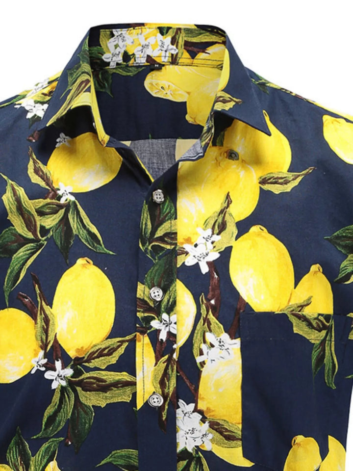 Close-up of the navy citrus print shirt collar, showing yellow lemons, green leaves, white flowers and the button front view.