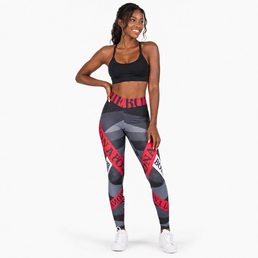 Printed yoga leggings with alphabet design in a lifestyle view, high waist styling and sizes S through XL for product review.