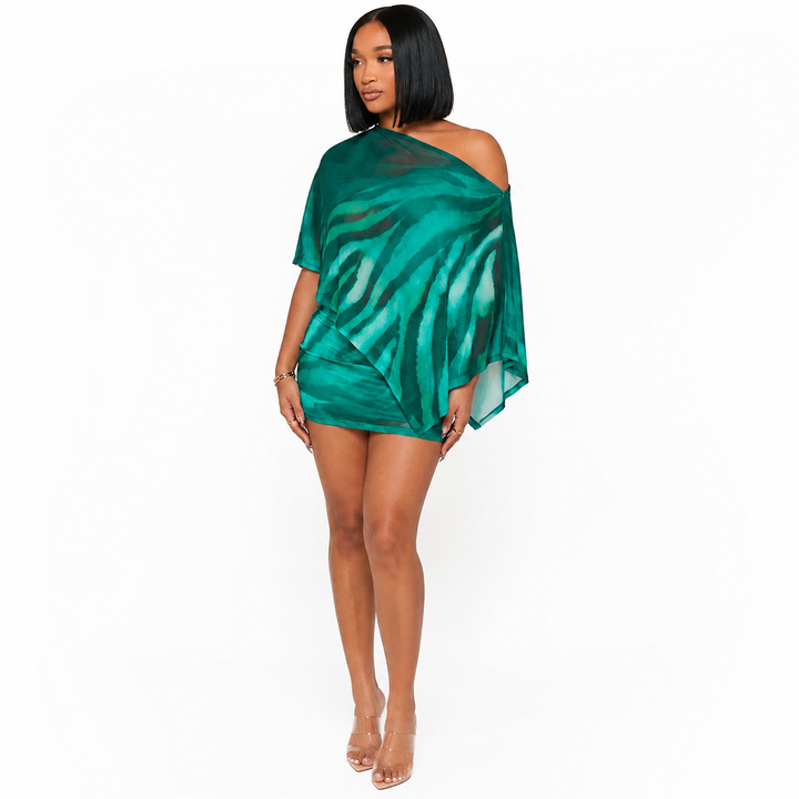 Animal print two piece set for women in green with asymmetric off shoulder overlay shown on a professional studio model.