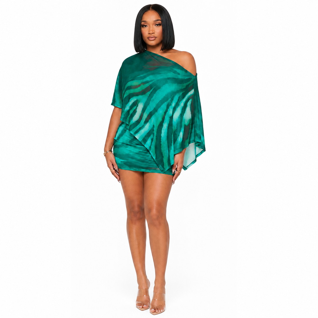 Green animal print two piece set shown in a clean front-facing ecommerce studio pose with the asymmetric off shoulder overlay.