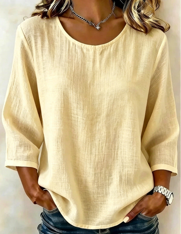 Additional solid-color crew neck top product image with three-quarter sleeve styling, displayed clearly for outfit reference.