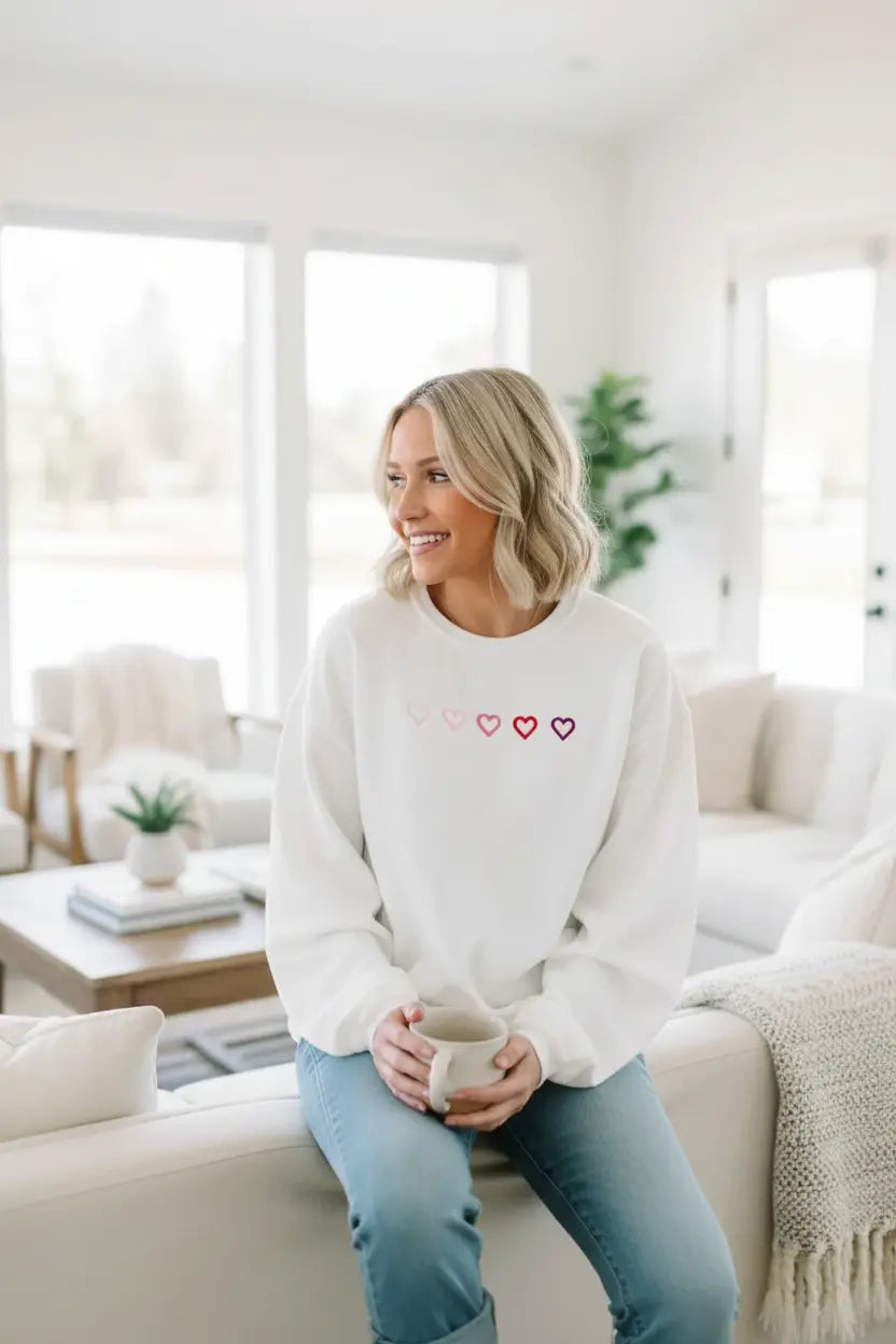 heart embroidered oversized sweatshirt side view with drop shoulder fit and roomy sleeves for cozy layering on cold days
