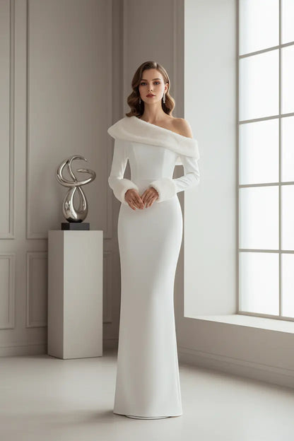 holiday party white dress in solid white, oblique collar detail visible, photographed beside decorated Christmas tree lights
