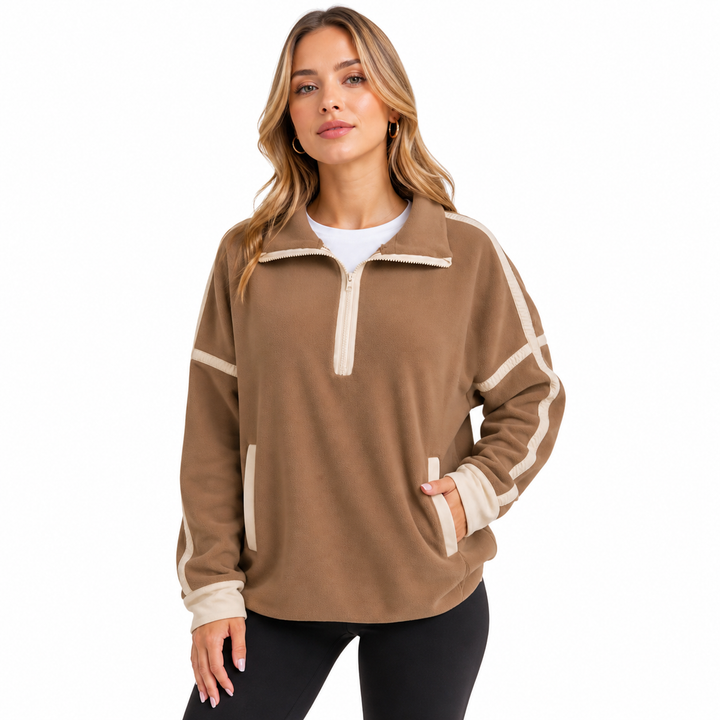 Relaxed fit half zip sweatshirt styled with fitted leggings for everyday wear