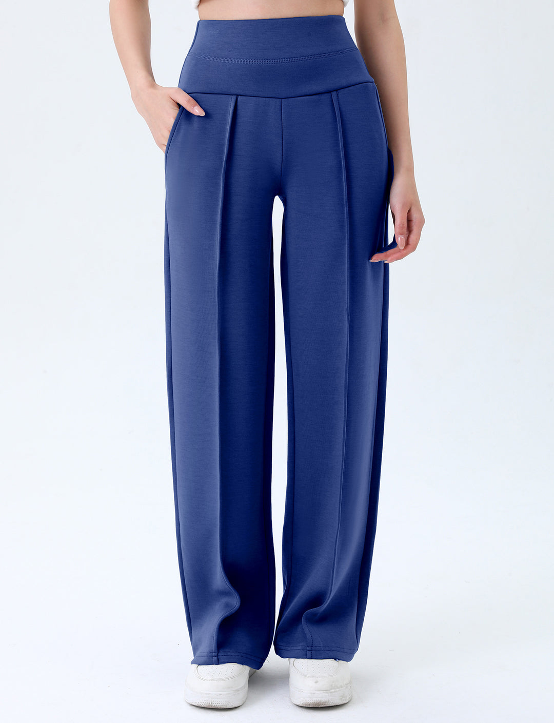 Supplier front view of blue athletic trousers with the broad stitched waistband, curved side pockets and loose straight legs.