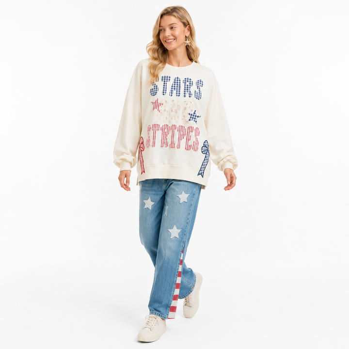BiBi stars stripes sweater showing cream base, charming bow detail, soft texture and comfortable holiday-ready styling easy!!