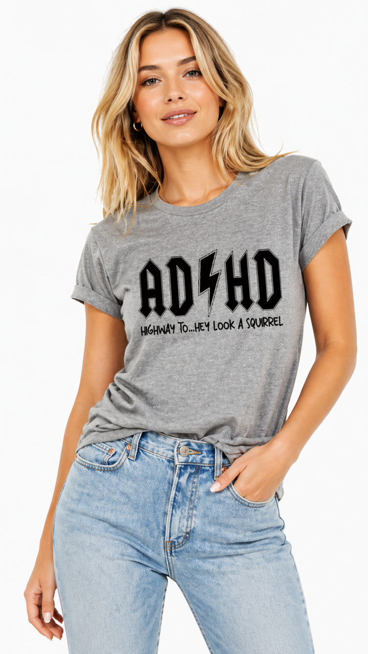 Woman wearing a gray t-shirt with &
