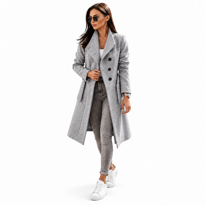 Grey belted coat for women shown full length on a model with dark buttons on a clean white studio background