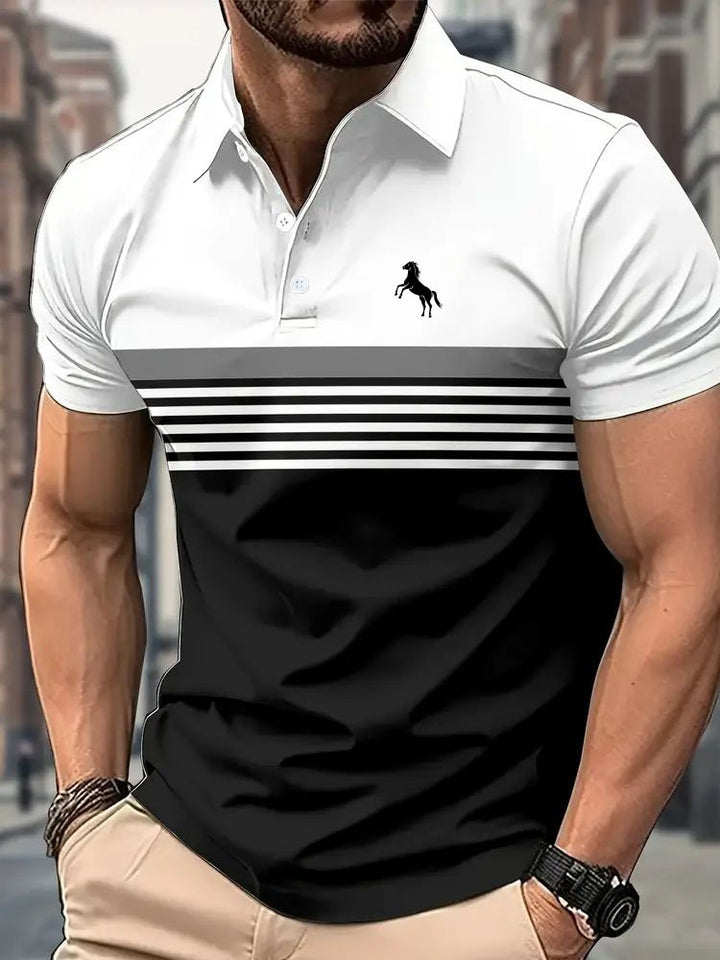 Man wearing a white and black striped polo shirt with a logo, standing against an urban background.