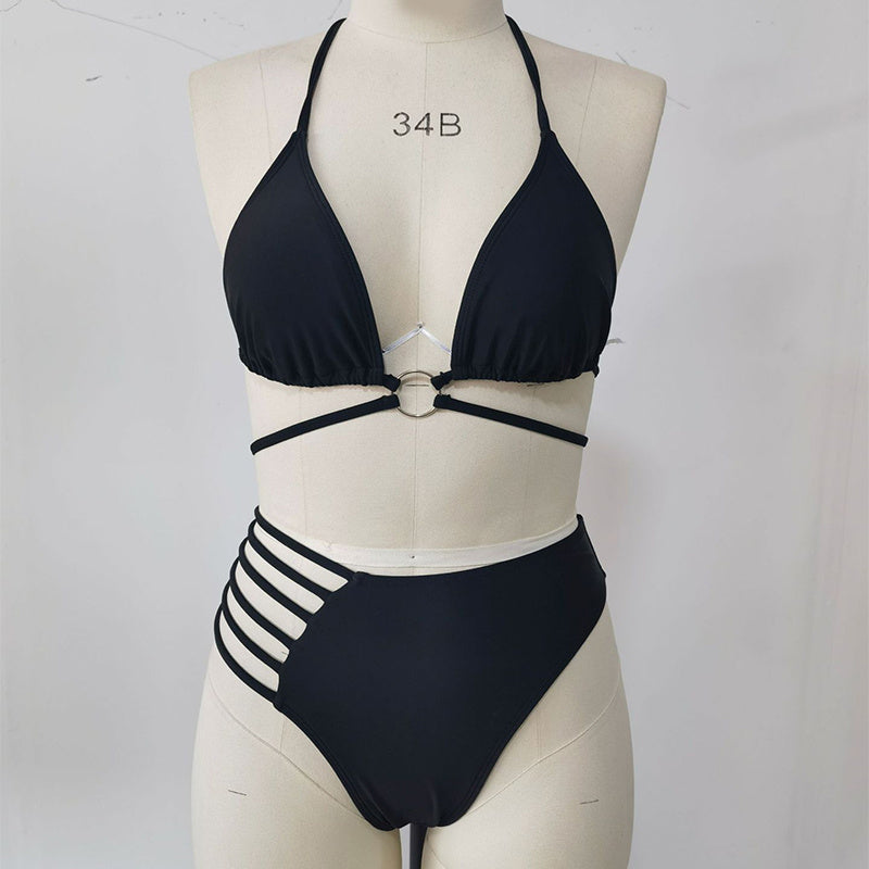 Black bikini front view on a supplier mannequin showing the halter neck, central ring, underbust ties and cutout side straps.