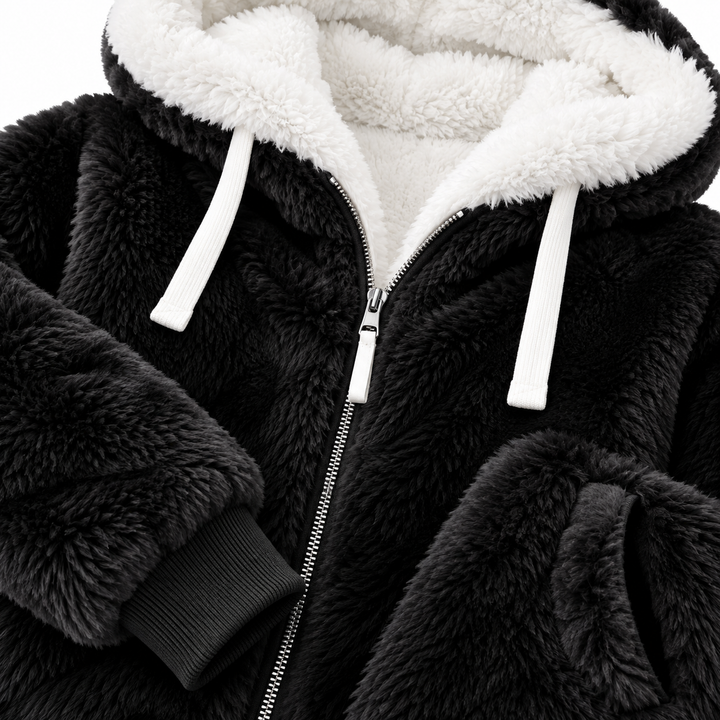 Black hooded jacket close-up showing white hood lining, zipper, cuff and pocket