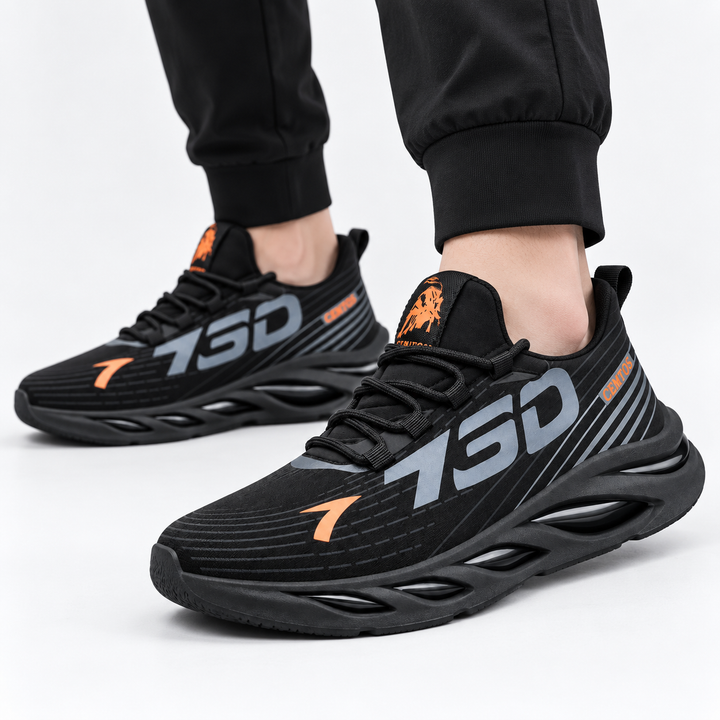 Black shoes worn with black jogger pants against a clean white studio background
