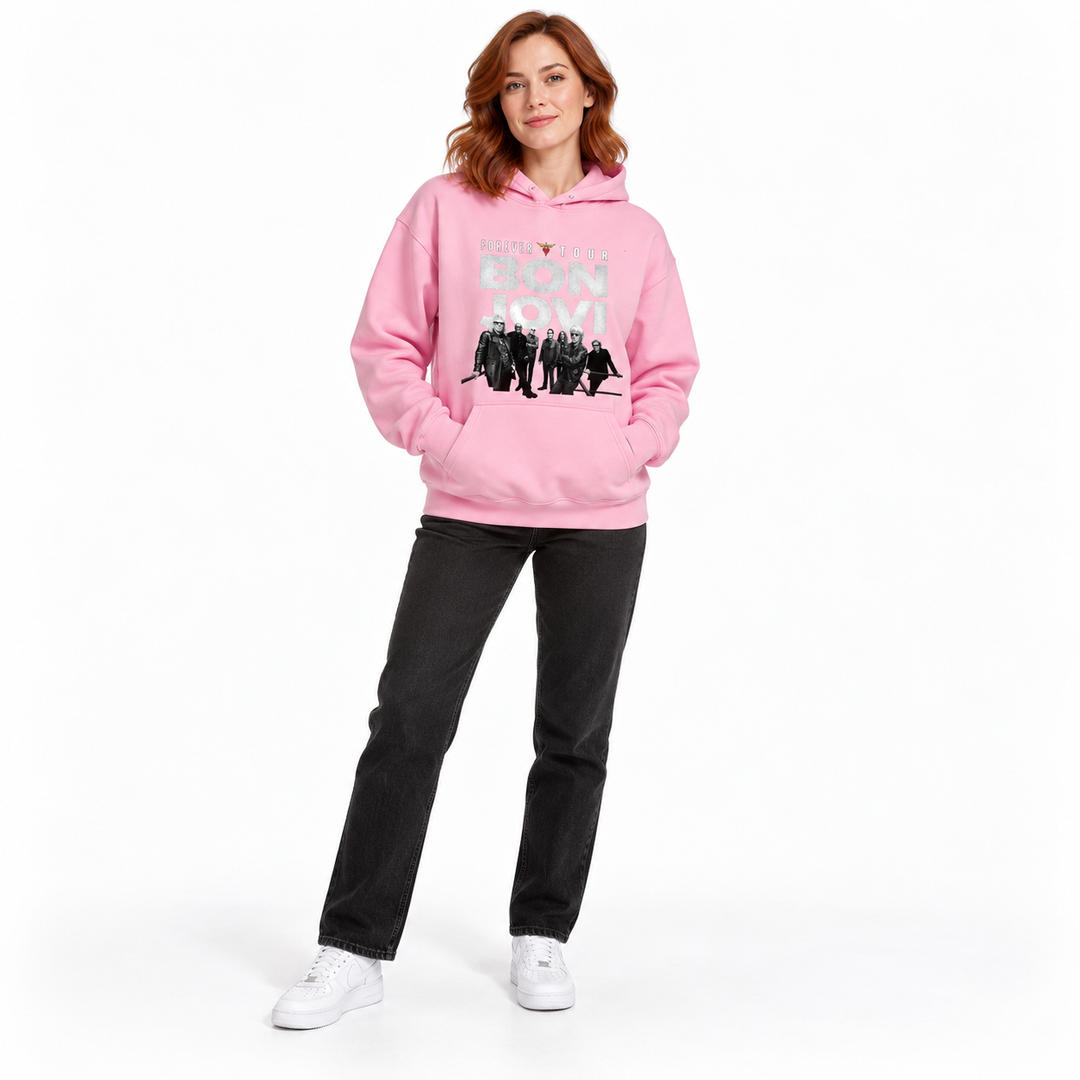 Pink graphic pullover hoodie shown from the front on a full-length female model wearing black jeans against a plain backdrop.