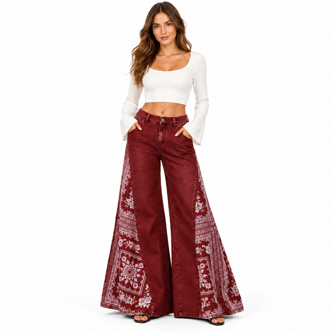 Burgundy wide leg pants in a full-body studio pose with white decorative side panels