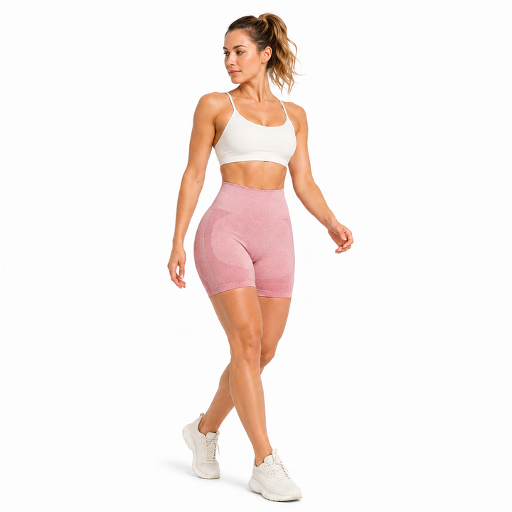 Pink seamless quick-dry yoga shorts in movement on female model