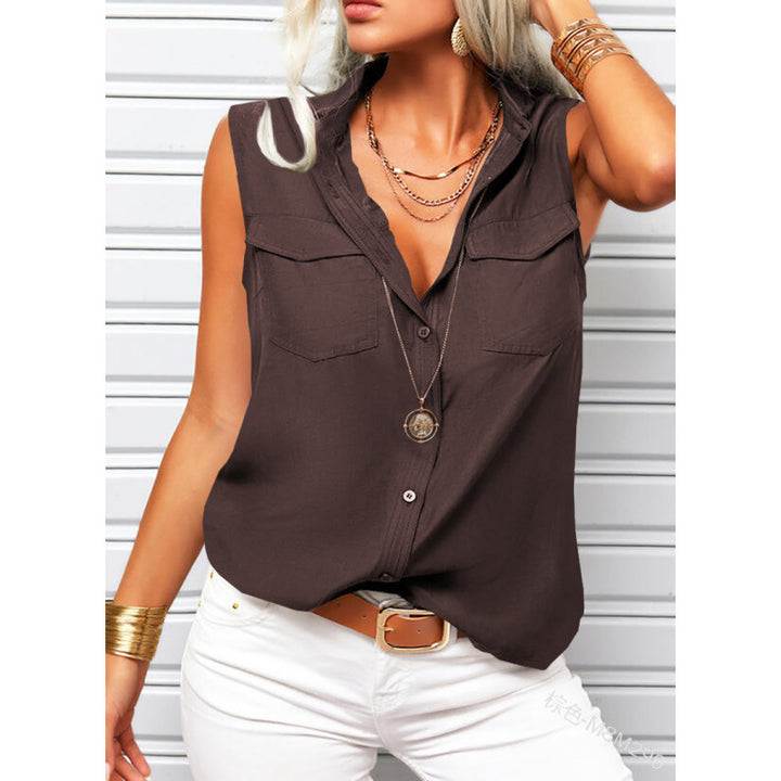 Woman wearing a brown sleeveless top and white pants against a white background