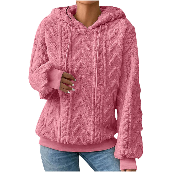 Peach textured hoodie on a model, shown from the front. The textured fabric appears in the pictured style and garment design.