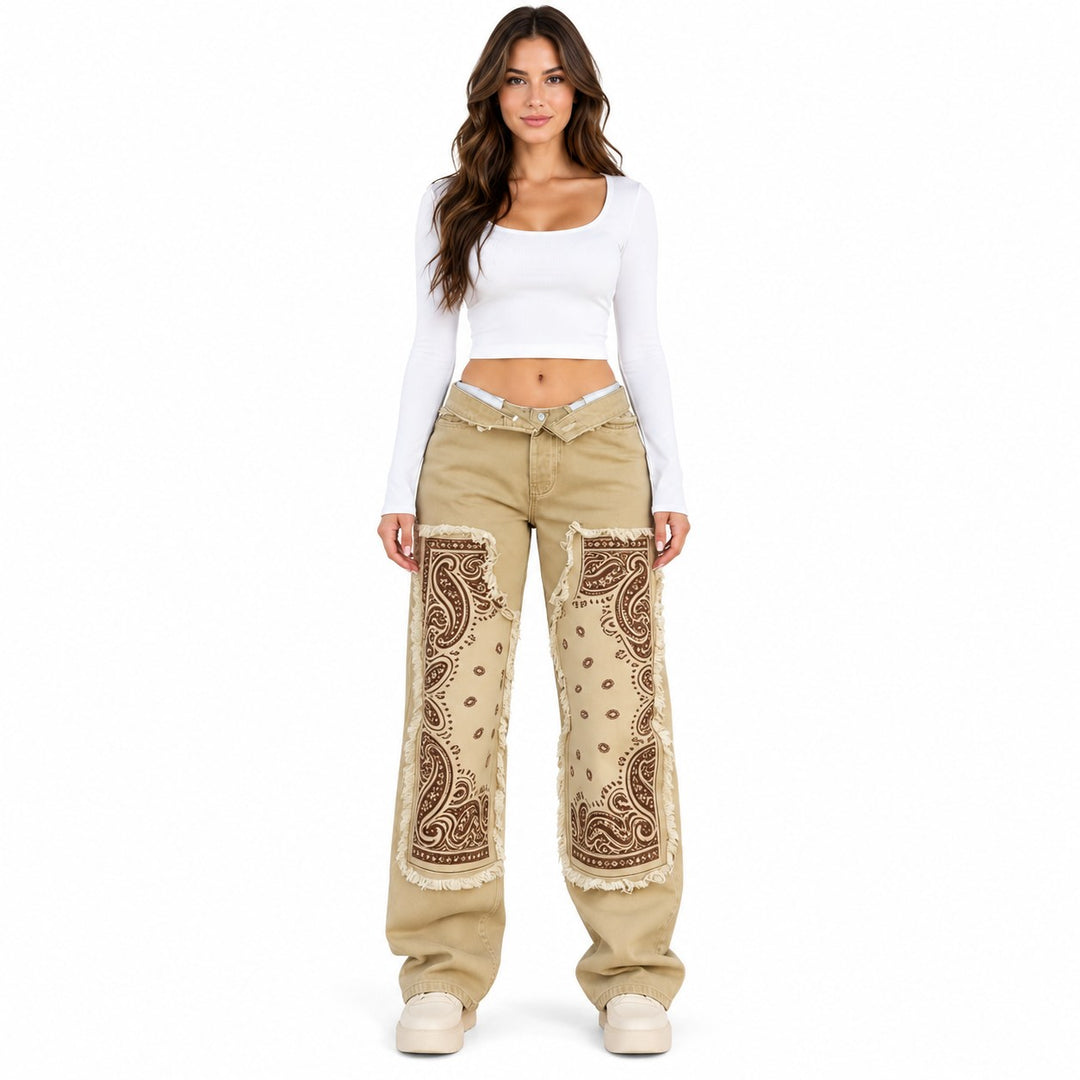 Patchwork wide leg jeans in Khaki on a full-body model, showing brown paisley panels, printed fringe effects and folded waist