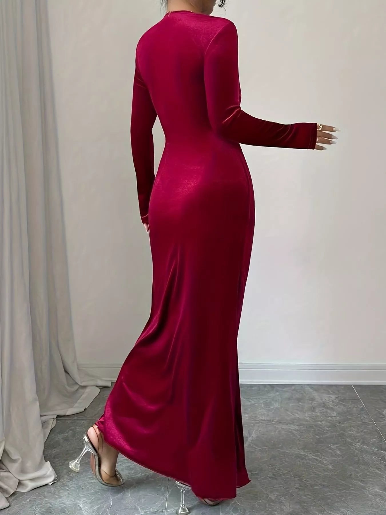 Long sleeve evening dress designed for formal occasions with clean finish