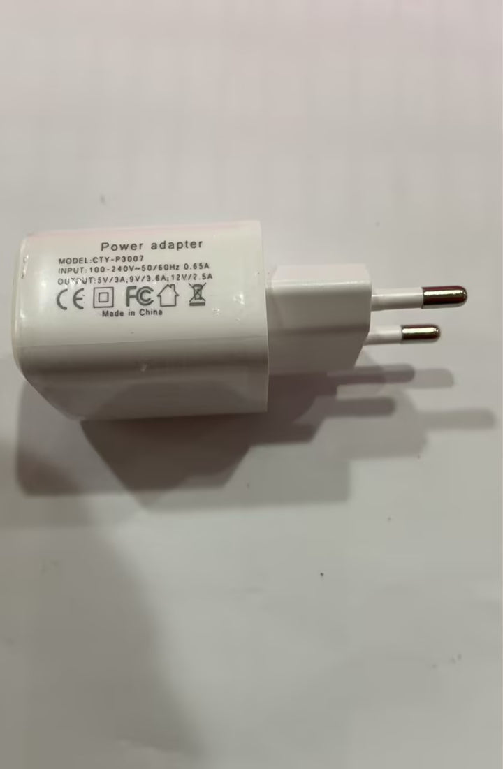 G shaped lamp for bedside or desk with Bluetooth audio, app-controlled lighting, wireless charging, clock and alarm features.