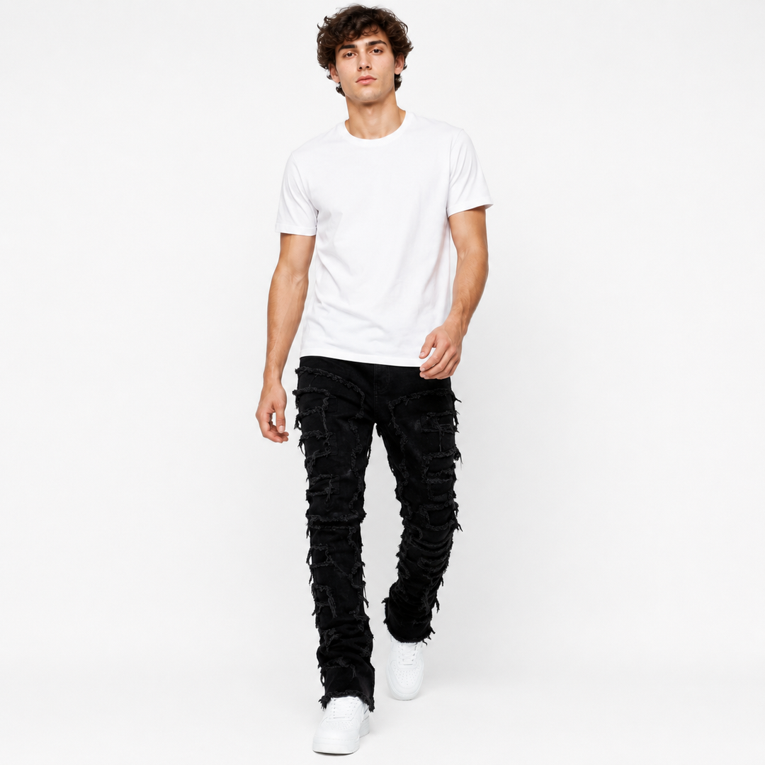 Ripped stacked jeans for men with slim fit silhouette and extended ankle stacking effect