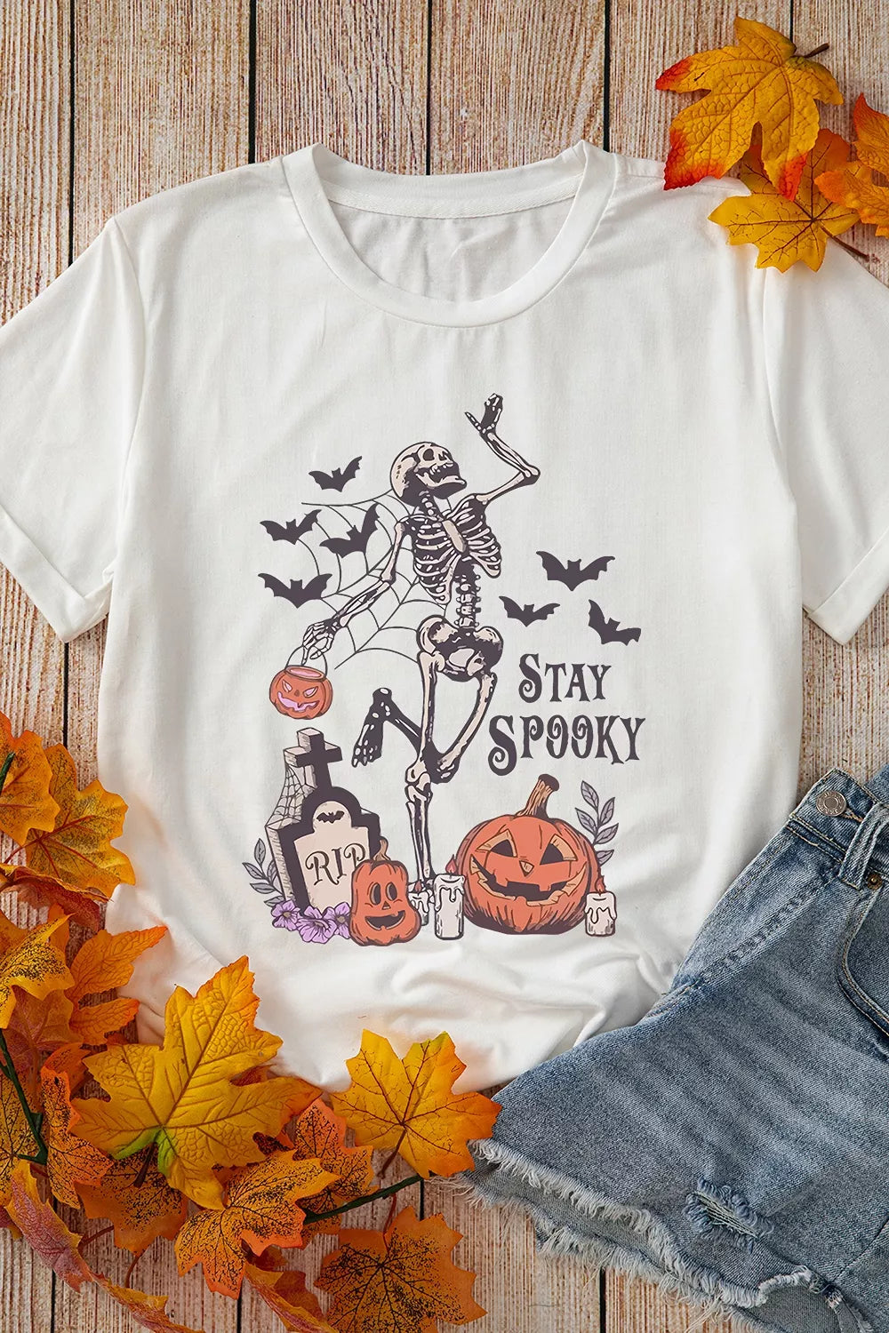 White graphic T-shirt with skull pumpkin print shown in the current Shopify product gallery