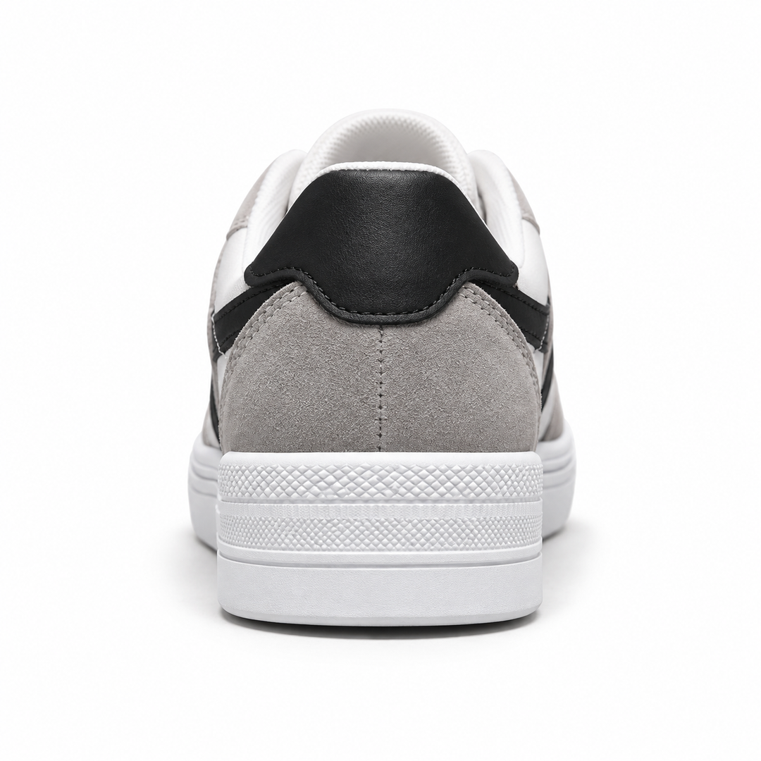 Back view of black striped canvas shoes showing the black heel tab, gray rear overlay and white textured sole.