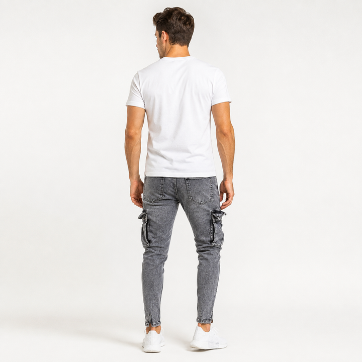 Washed gray cargo jeans for men shown from the back on an adult male model with tapered legs and visible cargo pocket styling.