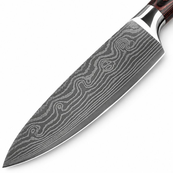 Close-up of patterned chef knife blade highlighting the visible etched-style surface design