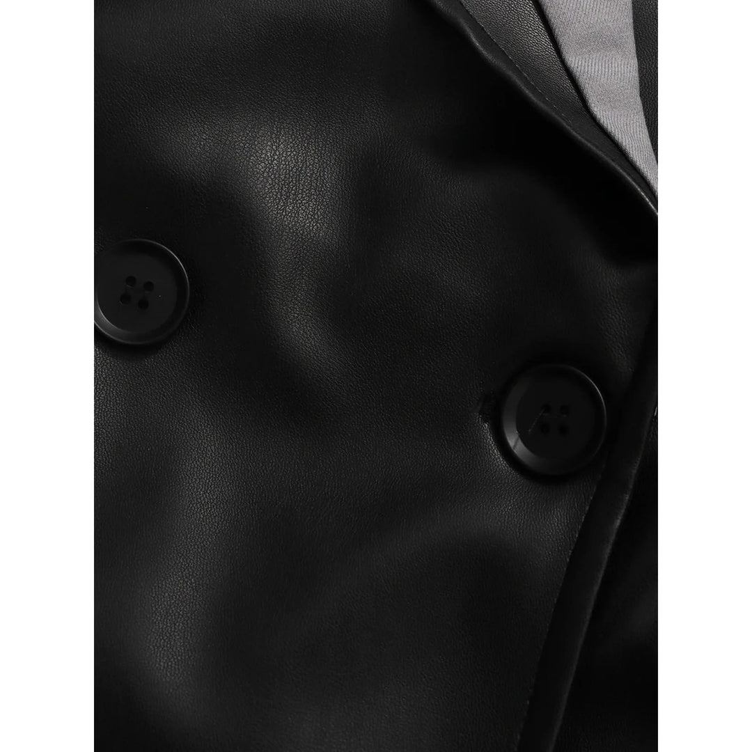 Close-up of the CHICEVER colorblock jacket showing two dark buttons and visible black surface texture