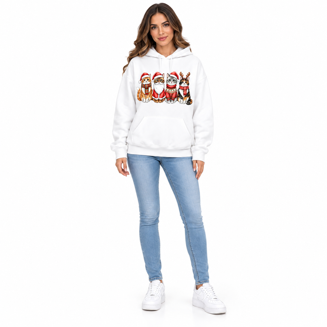 Full-length woman in a white hoodie with four Christmas cats, blue jeans and white trainers.