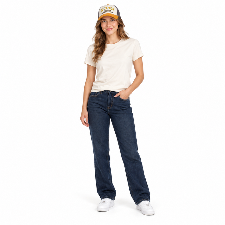 Adult woman in a cream T-shirt and jeans wearing the Gray and Ginger Yellow embroidered cap in full-length front studio view.