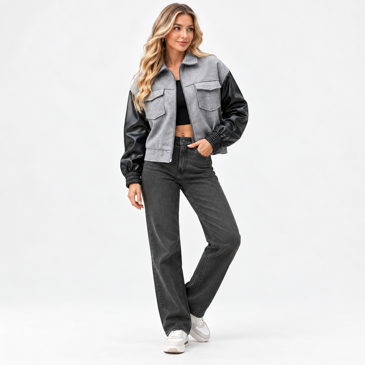 Light gray and black jacket styled on a full-body model against a clean background
