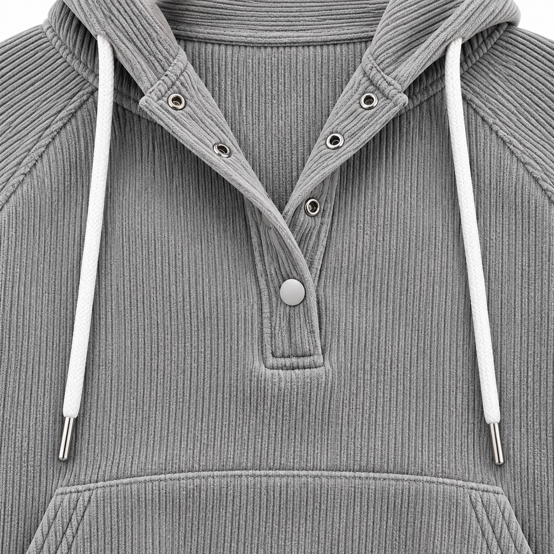Close-up of the grey ribbed hooded top showing a partial snap-button front, white drawstrings and top of the kangaroo pocket.